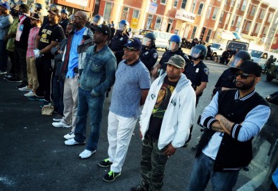 men-standing-police-line-baltimore